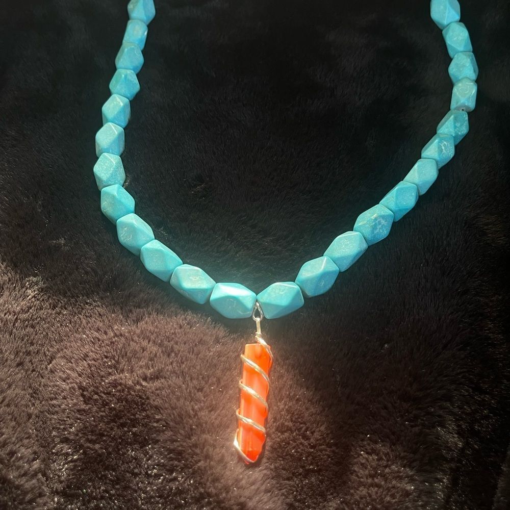 Turquoise beads with orange crystal charm